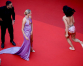 Protester painted in Ukraine colors ejected from Cannes red carpet