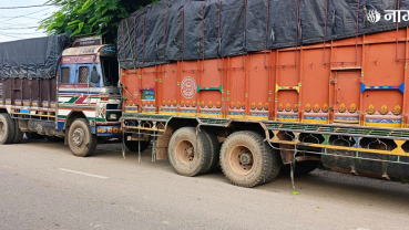 Trucks carrying customs-evaded cashew and carom seeds under police control