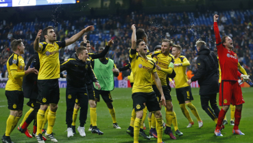 Dortmund holds Madrid 2-2 to win group, break scoring record