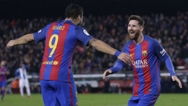 Barca cut deficit to Real thanks to magical Messi