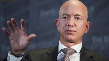 Bezos says Enquirer threatened to publish revealing pics
