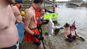 Nearly 2,000 people join annual plunge into icy Danube