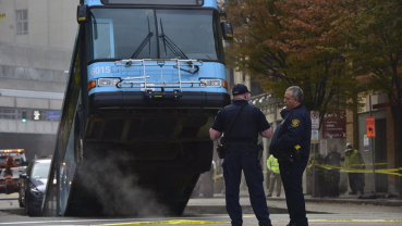 Cranes remove bus partially swallowed by Pittsburgh sinkhole