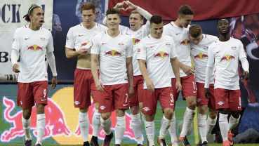 Promoted Leipzig brushes off critics to go top of the table