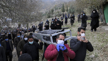 Far from the capital, Iran struggles to bury virus victims
