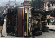 Two children injured after passenger bus overturns