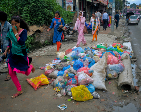 Garbage piles to stay on streets for one more week