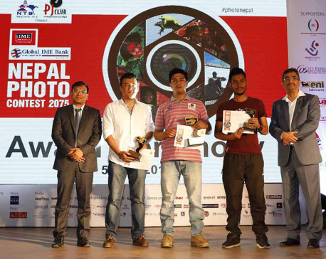 Photojournos Rokka and Rayamajhi bag photo contest award