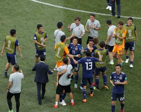 Japan squeeze into last 16 on disciplinary rule