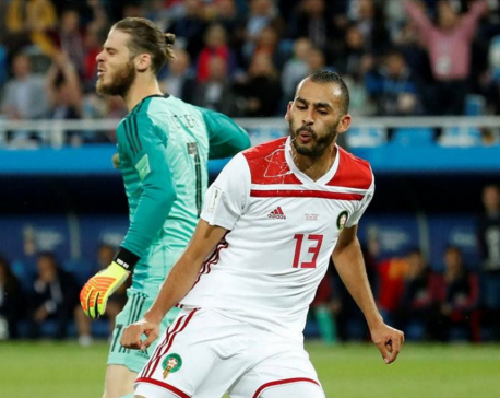 Spain snatch 2-2 draw with Morocco to top group