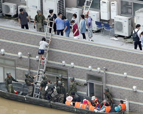 Death toll rises to nearly 100 as Japan scrambles to rescue flood victims