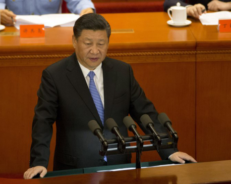 China’s Xi free trader to world, champion of Marx at home