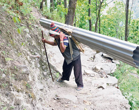 Quake victims toil 7hrs uphill with construction materials