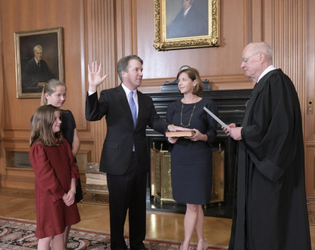 Kavanaugh sworn in as protesters chant outside Supreme Court