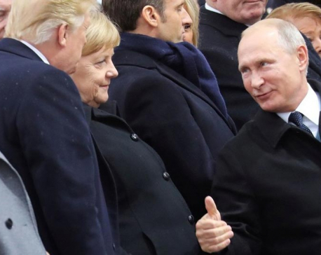 Thumbs up! Putin shakes hands with Trump and Melania during WWI ceremony in Paris