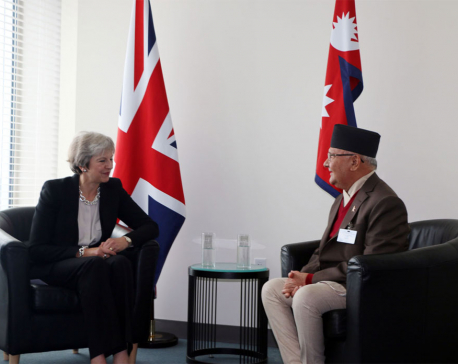 PM Oli, British PM May hold meeting