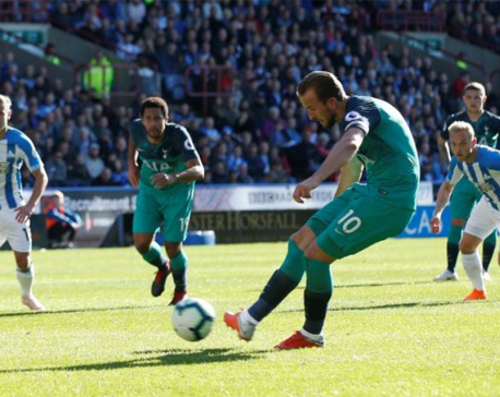 Kane double at Huddersfield sends Spurs fourth