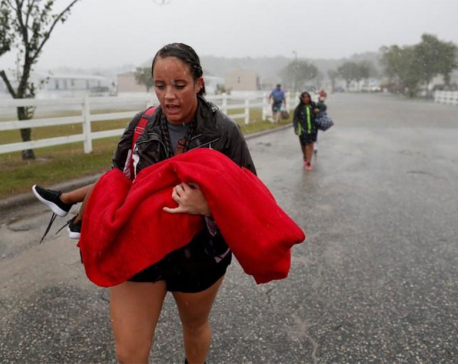 Flood waters rise as Florence pummels Carolinas; at least eight dead