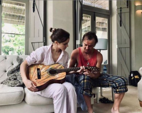 Tom Felton gives guitar lessons to 'quick learner' Emma Watson