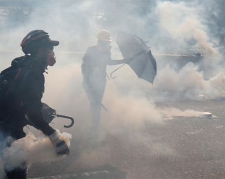 Hong Kong police use tear gas to counter protest petrol bombs