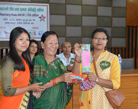 Women receive training to make sanitary pad