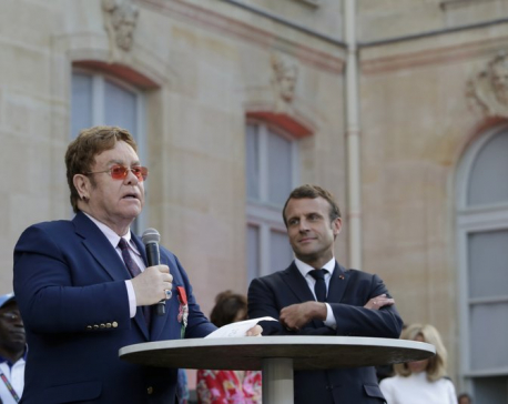 Elton John gets top French award, joins AIDS fight call