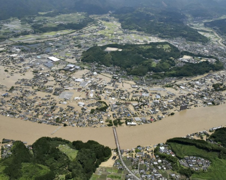 Heavy rain floods southern Japan; over a dozen presumed dead