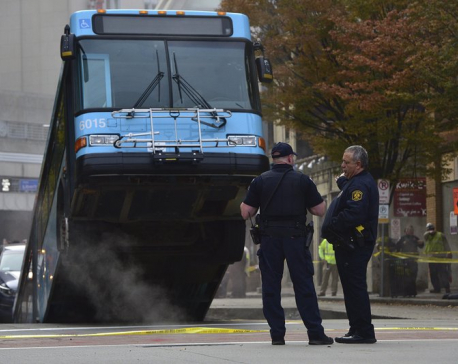 Cranes remove bus partially swallowed by Pittsburgh sinkhole