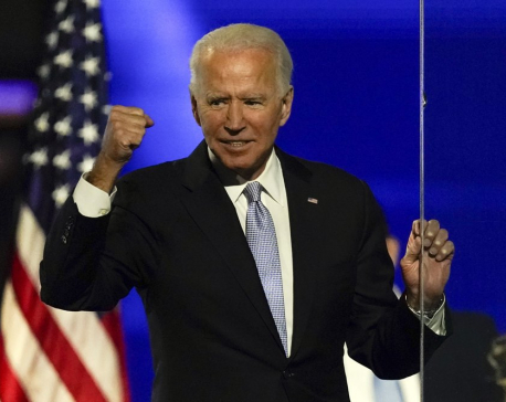 Biden promotes unity, turns to business of transition
