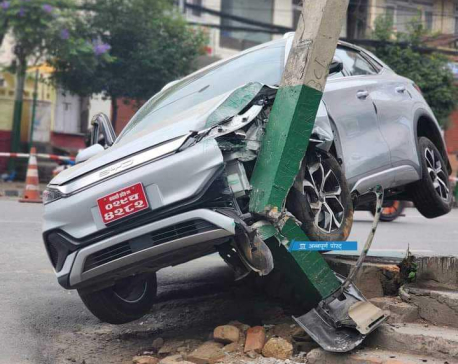 Car crashes into electricity pole in Kupondole, driver unharmed