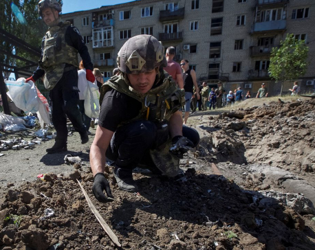 Battle in Ukraine's east rages, Zelenskiy vows to retake territory