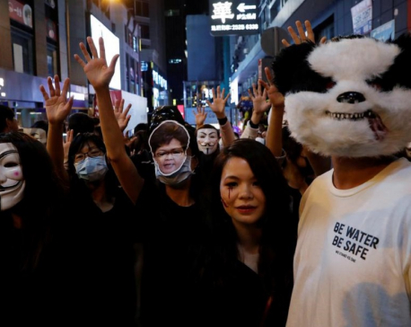 HK police fire tear gas in Kowloon as protesters across harbour gatecrash Halloween