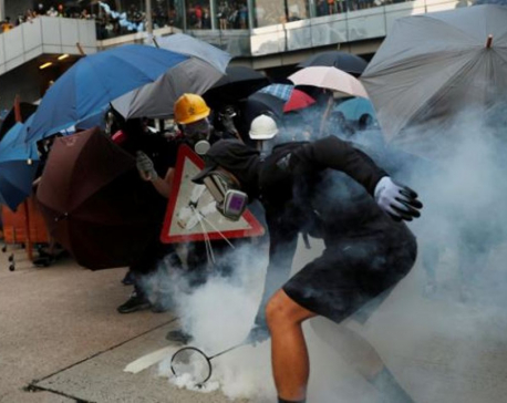 Battered and bruised, Hong Kong cleans up for sensitive Chinese anniversary