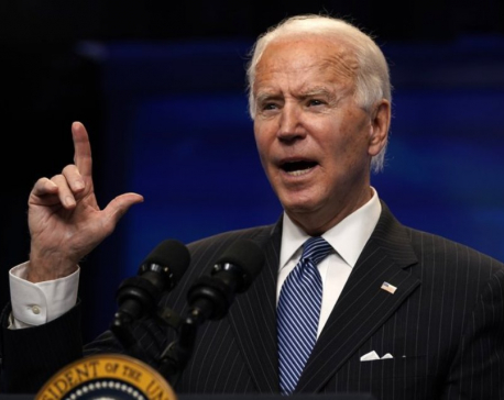 Government shutdown averted with little time to spare as Biden signs funding before midnight