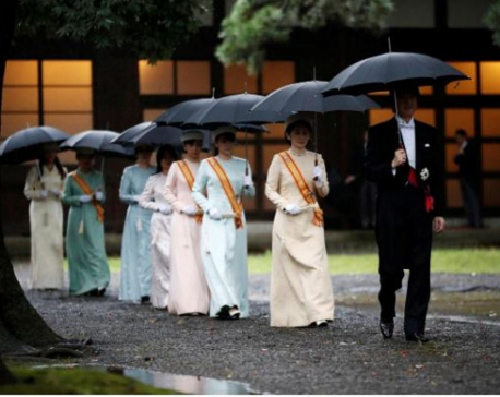 Japanese emperor begins enthronement ritual amid downpour