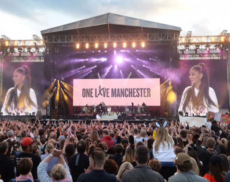 Grande returns to Manchester to honor victims with benefit