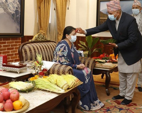President Bhandari receives Dashain tika from priests