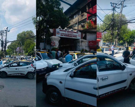 Cabbies stage protest against KMC’s decision to bar them from parking at roadside