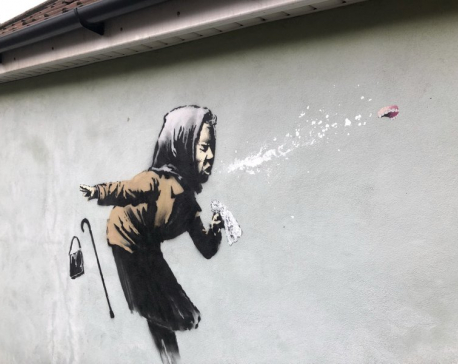 UK homeowner delays sale of home after Banksy mural appears