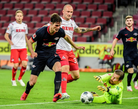 Soccer-Leipzig move into third spot with 4-2 win at Cologne