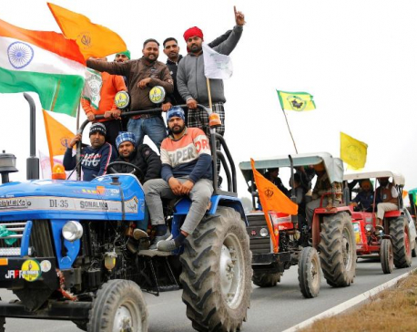 Indian farmers ride caravan of tractors into capital ahead of Republic Day