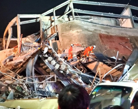 Four die at collapsed China quarantine site; virus spread slows ex-Wuhan