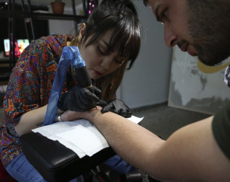 A tattoo at a time, Afghan woman takes on society’s taboos