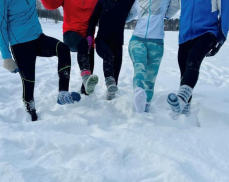 Weary of COVID restrictions, Finns take up running in deep snow in socks