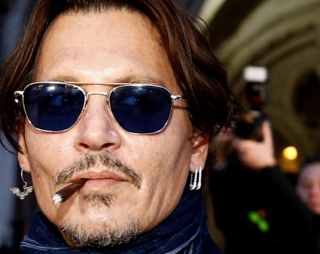 Actor Johnny Depp takes Sun newspaper to court in 'wife beater' libel case