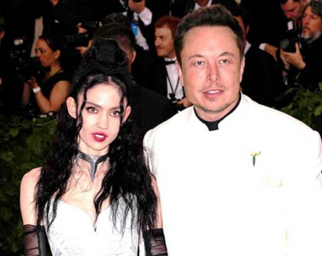 Elon Musk says he and musician girlfriend Grimes are 'semi-separated'