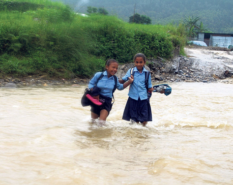 Children compelled to cross raging monsoon river to get to school