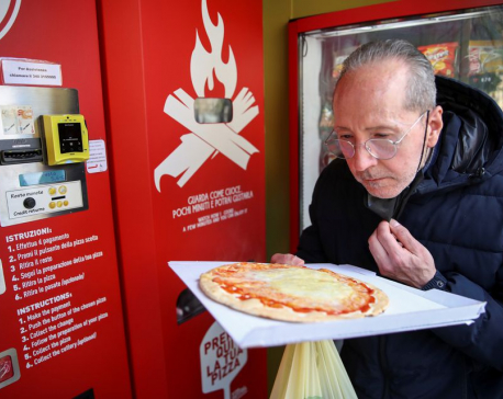 Fresh pizza vending machine prompts curiosity and horror in Rome