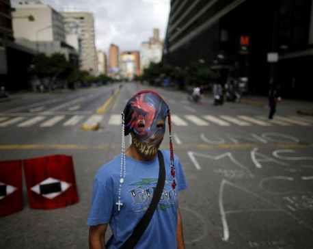 Venezuela leader’s foes levy new sanctions and fresh strike