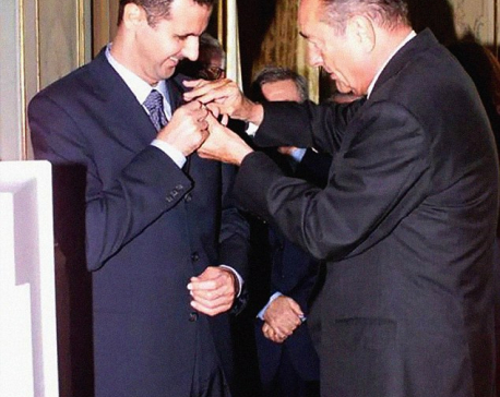 Bashar al Assad hands back Legion d'Honneur medal as he calls the French 'slaves of the US' after missile attack